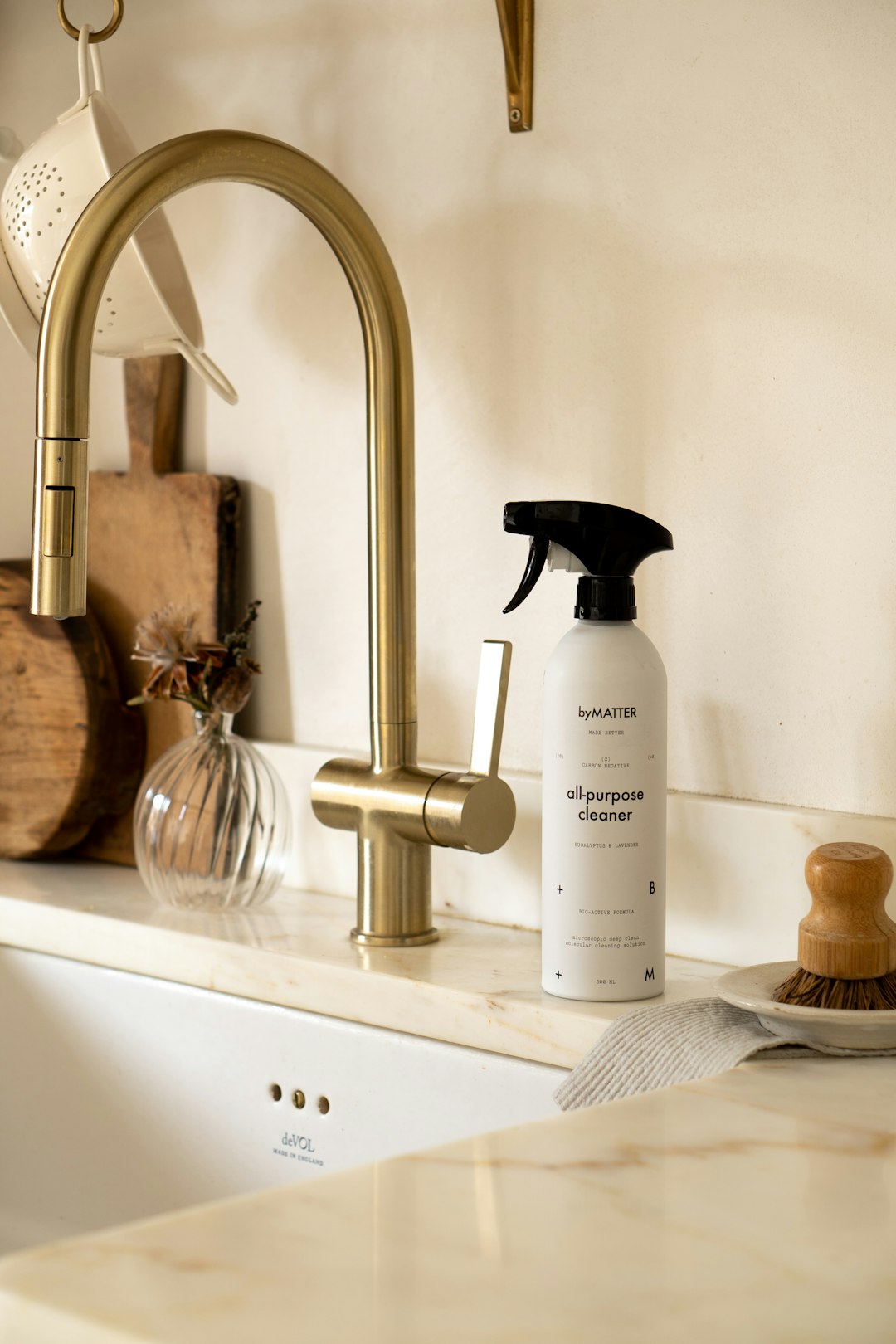 a-bottle-of-cleaner-sitting-on-top-of-a-sink-zhghuq1li54
